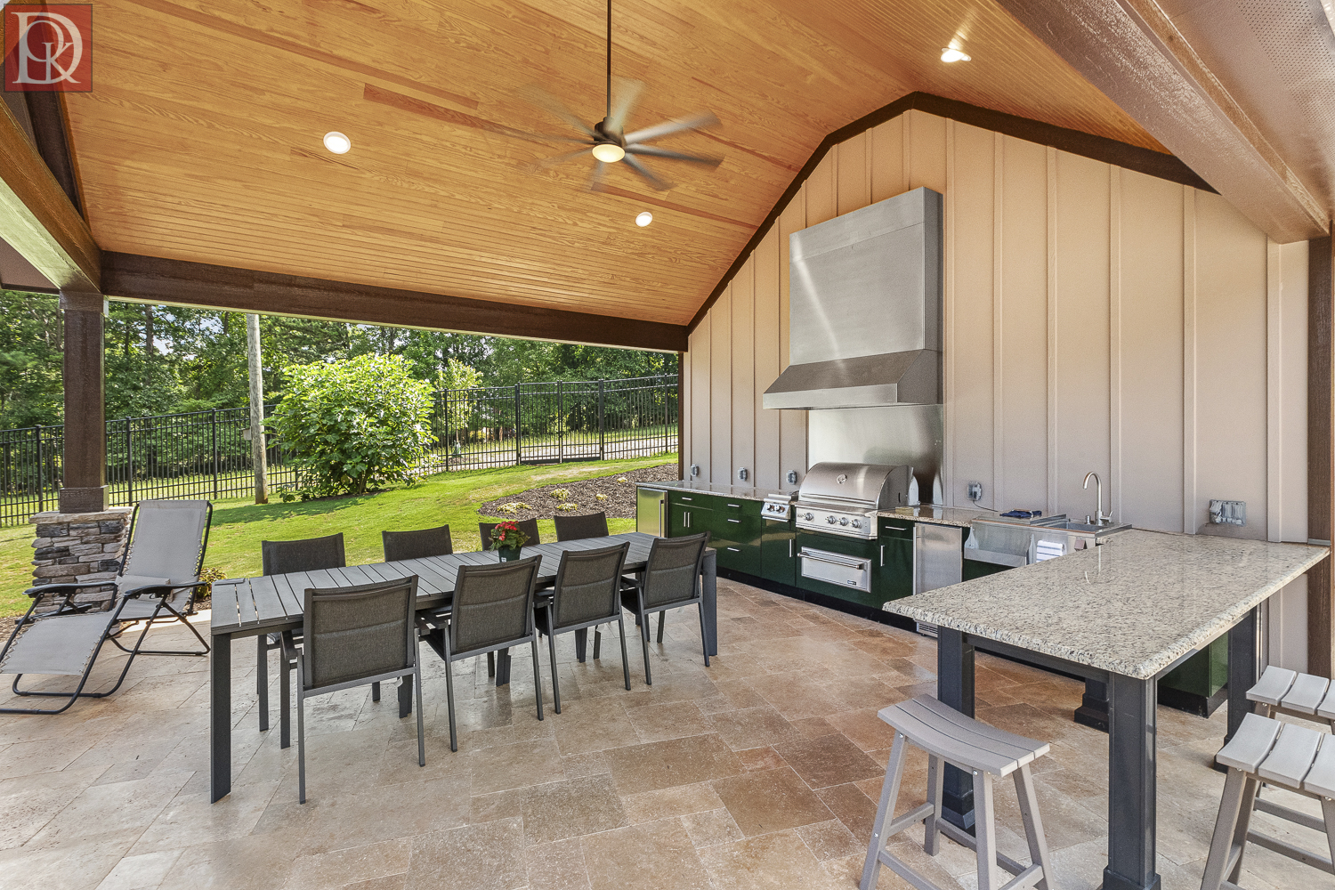 014b Custom outdoor kitchen under construction with stone surfaces and premium appliances